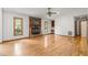 Spacious open living room featuring hardwood floors and a stone fireplace, ideal for entertaining at 601 Wofford Rd, Durham, NC 27707