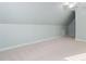 Attic with vaulted ceilings and neutral carpet, perfect for extra space at 602 Preston Village Way, Cary, NC 27519