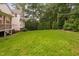 Expansive backyard with mature trees, providing a private outdoor oasis at 602 Preston Village Way, Cary, NC 27519