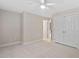 Bedroom has a double door closet, neutral carpet, and ceiling fan at 602 Preston Village Way, Cary, NC 27519