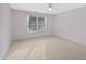 Cozy bedroom features neutral carpet and natural light through window at 602 Preston Village Way, Cary, NC 27519