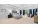 Spacious main bedroom with tray ceilings, plush carpet, and ample natural light at 602 Preston Village Way, Cary, NC 27519