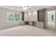 Bedroom with built-in desk area and shelving offers a functional workspace at 602 Preston Village Way, Cary, NC 27519