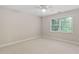 Sunlit bedroom includes a window view and neutral wall color at 602 Preston Village Way, Cary, NC 27519