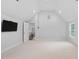 Bonus room featuring a vaulted ceiling, TV and access to the upper hall at 602 Preston Village Way, Cary, NC 27519
