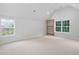Bright bonus room featuring two windows and a climbing wall at 602 Preston Village Way, Cary, NC 27519