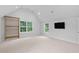 Large bonus room with a climbing wall and ample natural light at 602 Preston Village Way, Cary, NC 27519