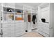 Organized walk-in closet with shelving, drawers, and hanging rods for efficient storage at 602 Preston Village Way, Cary, NC 27519