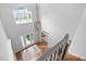 Bright foyer boasts hardwood floors, a contemporary chandelier, and a large window at 602 Preston Village Way, Cary, NC 27519