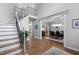 Home foyer boasts an elegant staircase and opens into a formal dining area at 602 Preston Village Way, Cary, NC 27519