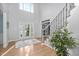 Grand foyer featuring high ceilings, hardwood floors, staircase, and an abundance of natural light at 602 Preston Village Way, Cary, NC 27519