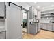Charming kitchen with white cabinets, stainless steel appliances and granite countertops at 602 Preston Village Way, Cary, NC 27519