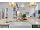 Gourmet kitchen island boasts a gold faucet, white ceramic sink, and lovely decorations at 602 Preston Village Way, Cary, NC 27519