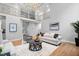 Large living room with hardwood flooring, high ceilings, and modern lighting at 602 Preston Village Way, Cary, NC 27519