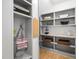 Organized mudroom features custom built-ins, multiple shelves, and hooks for storage and convenience at 602 Preston Village Way, Cary, NC 27519