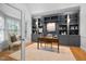 Beautiful office with custom built-in shelves, wood desk, and natural light from windows at 602 Preston Village Way, Cary, NC 27519