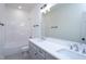 Well-lit bathroom features double sinks, quartz countertops, and a shower-tub combo at 6069 Jones Cir, Sanford, NC 27332