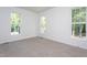 Bedroom with carpet and three windows; lots of natural light at 6069 Jones Cir, Sanford, NC 27332