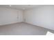 Carpeted bedroom features recessed lights and a white paneled door at 6069 Jones Cir, Sanford, NC 27332