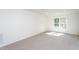 Spacious, carpeted bedroom with a large window for natural light at 6069 Jones Cir, Sanford, NC 27332
