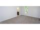 Bedroom with carpet and view into the bathroom; plenty of natural light at 6069 Jones Cir, Sanford, NC 27332