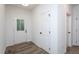 Clean and bright entryway with wood-look floors and a view of the exterior at 6069 Jones Cir, Sanford, NC 27332