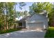 Charming home featuring a quaint porch, well-kept lawn, and garage at 6069 Jones Cir, Sanford, NC 27332