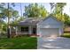Exterior of house with covered porch, black front door, and garage at 6069 Jones Cir, Sanford, NC 27332