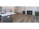 Open concept living area with kitchen island and fireplace at 6069 Jones Cir, Sanford, NC 27332