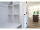 Mudroom has storage cubbies, bench, and a view into kitchen at 6069 Jones Cir, Sanford, NC 27332