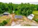 Aerial view of property featuring an outbuilding outfitted with solar panels at 6318 Hurdle Mills Rd, Roxboro, NC 27574