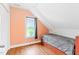 Bedroom with hardwood floors, neutral accent wall, and plenty of natural light at 6318 Hurdle Mills Rd, Roxboro, NC 27574