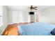 Comfortable bedroom featuring hardwood floors, ceiling fan, and closet, creating a cozy retreat at 6318 Hurdle Mills Rd, Roxboro, NC 27574