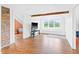 Spacious bonus room with window bench, hardwood floors and charming brick accent at 6318 Hurdle Mills Rd, Roxboro, NC 27574
