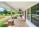 Spacious front porch offering a comfortable spot with lovely views of the surrounding landscape at 6318 Hurdle Mills Rd, Roxboro, NC 27574