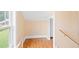 Hallway with wooden floors, natural light and access to different parts of the home at 6318 Hurdle Mills Rd, Roxboro, NC 27574