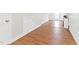 Hallway with laminate flooring, accent lighting and neutral color palette at 6318 Hurdle Mills Rd, Roxboro, NC 27574