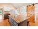Contemporary kitchen with a sink in the island and a stainless steel fridge at 6318 Hurdle Mills Rd, Roxboro, NC 27574