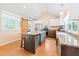 Spacious kitchen with an island and barn door to the laundry room at 6318 Hurdle Mills Rd, Roxboro, NC 27574