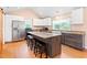 Well-appointed kitchen with large island, seating, and bright lighting at 6318 Hurdle Mills Rd, Roxboro, NC 27574