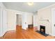 Spacious room with hardwood floors, fireplace, and easy access to other areas, perfect for entertaining at 6318 Hurdle Mills Rd, Roxboro, NC 27574