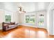 Sunlit living room with hardwood floors, and a comfortable couch at 6318 Hurdle Mills Rd, Roxboro, NC 27574