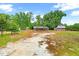 Several outbuildings with solar panels, in a rustic style, are situated in a large lot at 6318 Hurdle Mills Rd, Roxboro, NC 27574