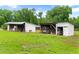 Image of two sheds, one with open bays perfect for equipment or storage, set in a grassy yard at 6318 Hurdle Mills Rd, Roxboro, NC 27574