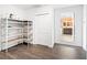 Storage room featuring metal shelving and hardwood floors, offering practical organization and style at 6318 Hurdle Mills Rd, Roxboro, NC 27574