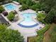 Aerial view of community pool, including multiple pools and seating areas at 633 Rolling Springs Dr, Cary, NC 27519