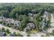 An aerial view reveals the house and neighborhood, with tree-lined streets and manicured lawns at 633 Rolling Springs Dr, Cary, NC 27519