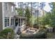 Beautiful backyard with a screened-in porch and stone fire pit at 633 Rolling Springs Dr, Cary, NC 27519