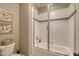 Modern bathroom with a glass shower, tile surround and decorative wall art at 633 Rolling Springs Dr, Cary, NC 27519