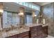 Bathroom featuring double vanities, granite countertops and patterned wallpaper at 633 Rolling Springs Dr, Cary, NC 27519